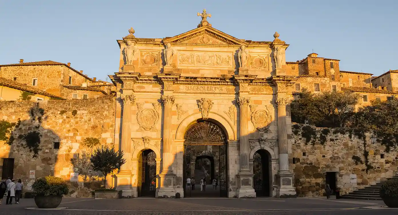 Porta all'Arco in Volterra at sunset, Etruscan stone gate and medieval alleys